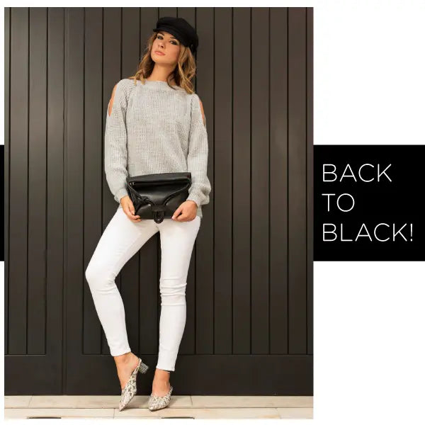 women hold esin akan black bag