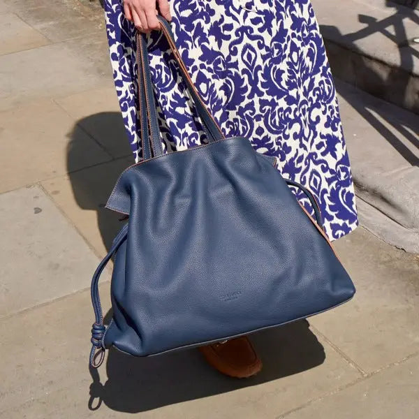 women holding leather bag