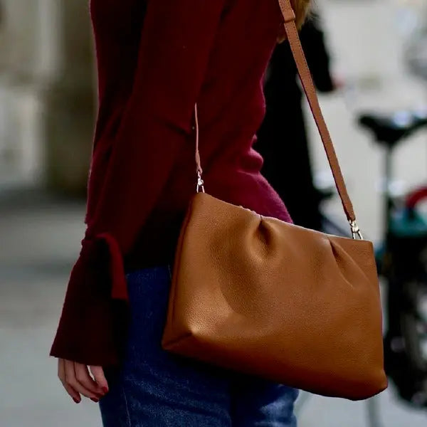 young girl holding esin akans bag