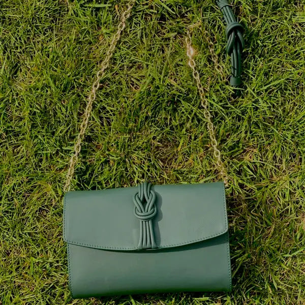 women hold white bag